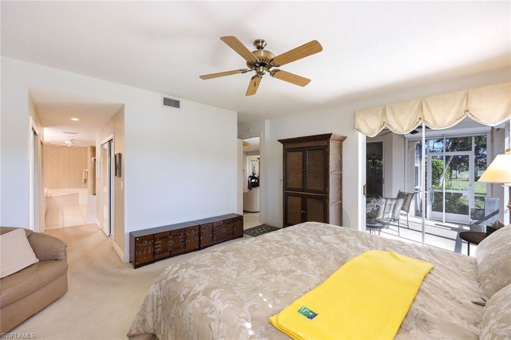Carpeted bedroom with access to outside and a ceiling fan