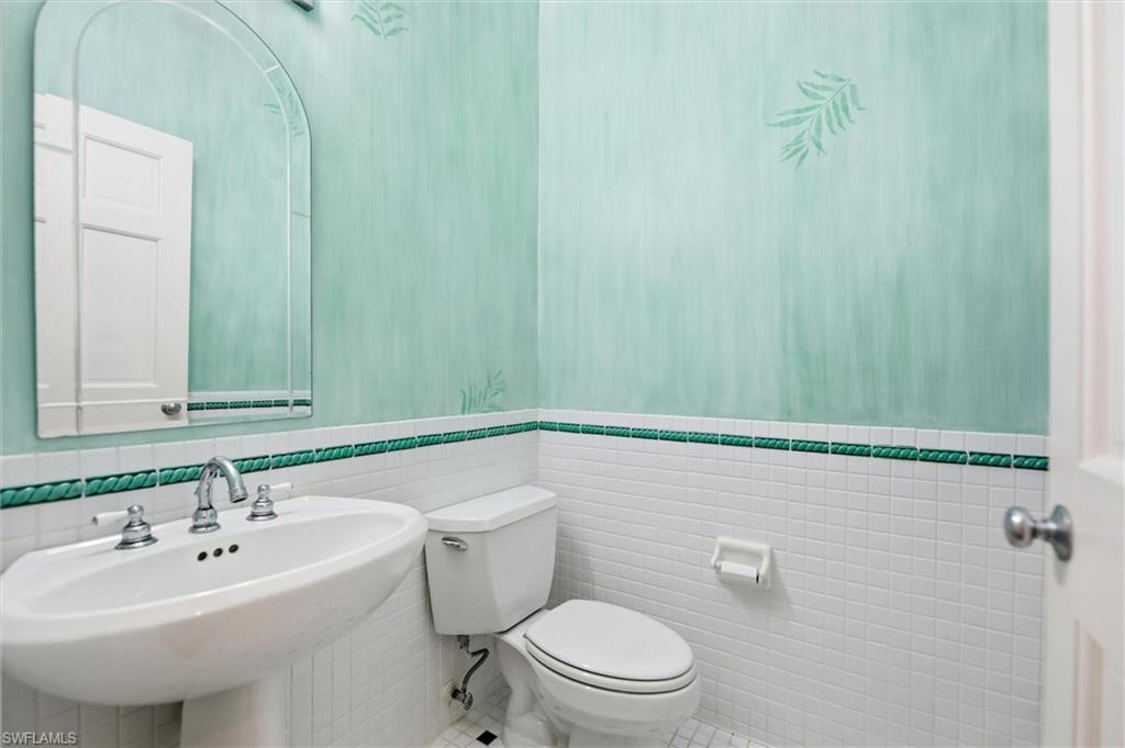 Bathroom featuring tile walls and tile patterned floors