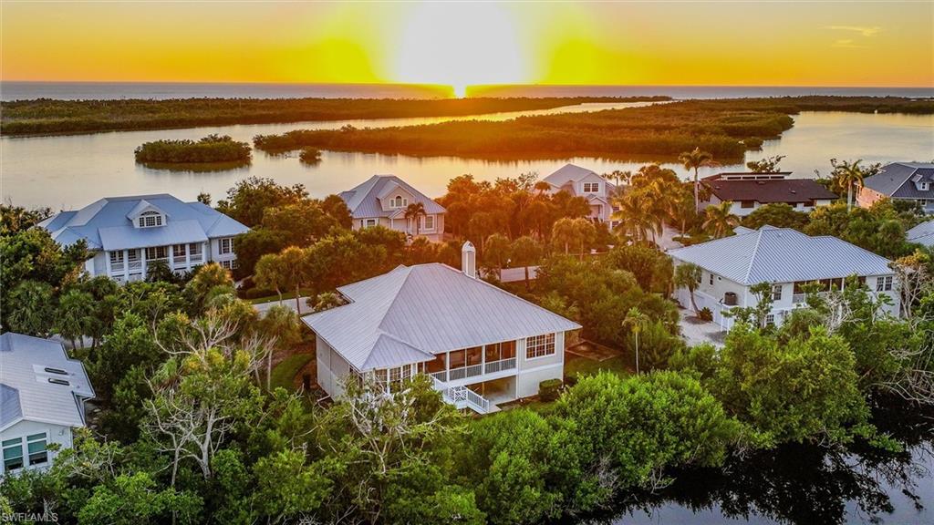 Aerial perspective of suburban area with a nearby body of water