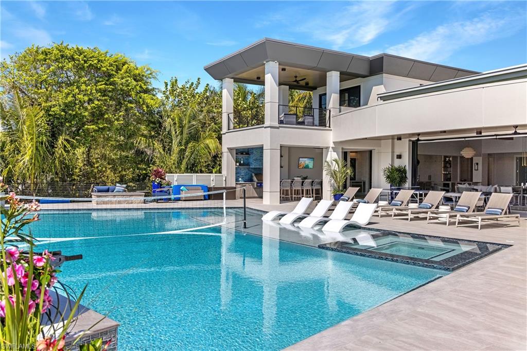 Elevated pool & deck flows right off the living areas blurring the lines between indoors and out