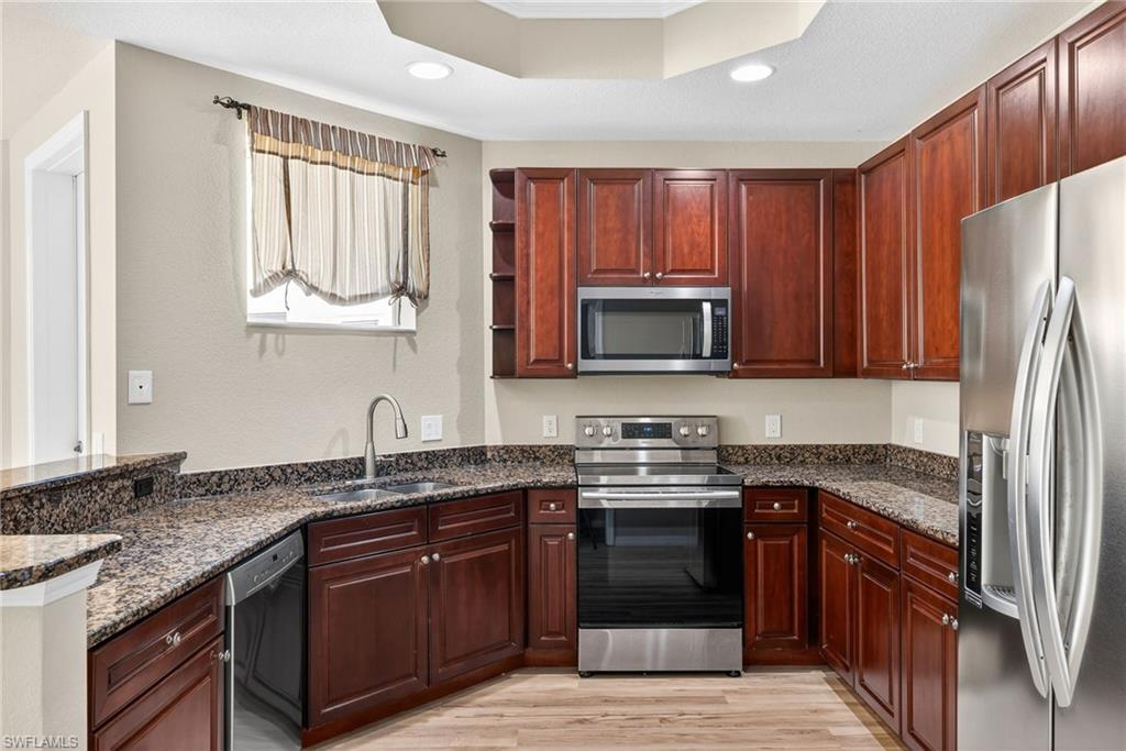 42" wood cabinets and stainless steel appliances