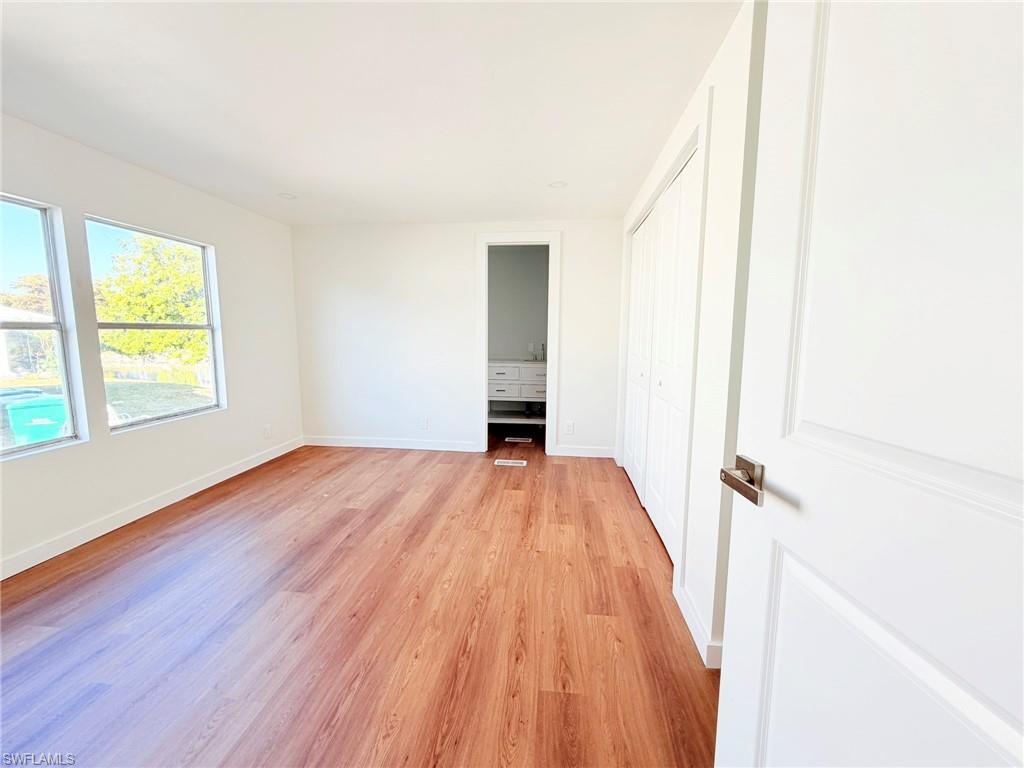 Spacious and serene, the primary bedroom features fresh finishes and plenty of natural light for a peaceful retreat.
