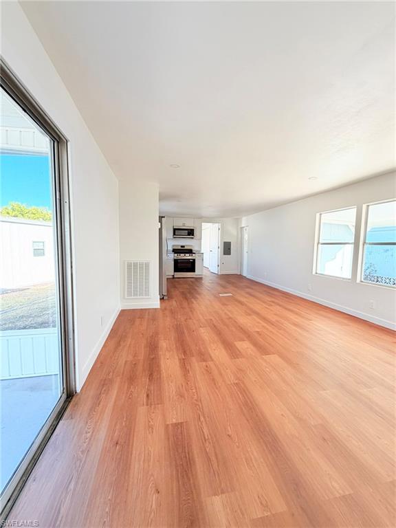 An open and airy layout seamlessly connects the kitchen and dining space, ideal for everyday living and hosting guests.