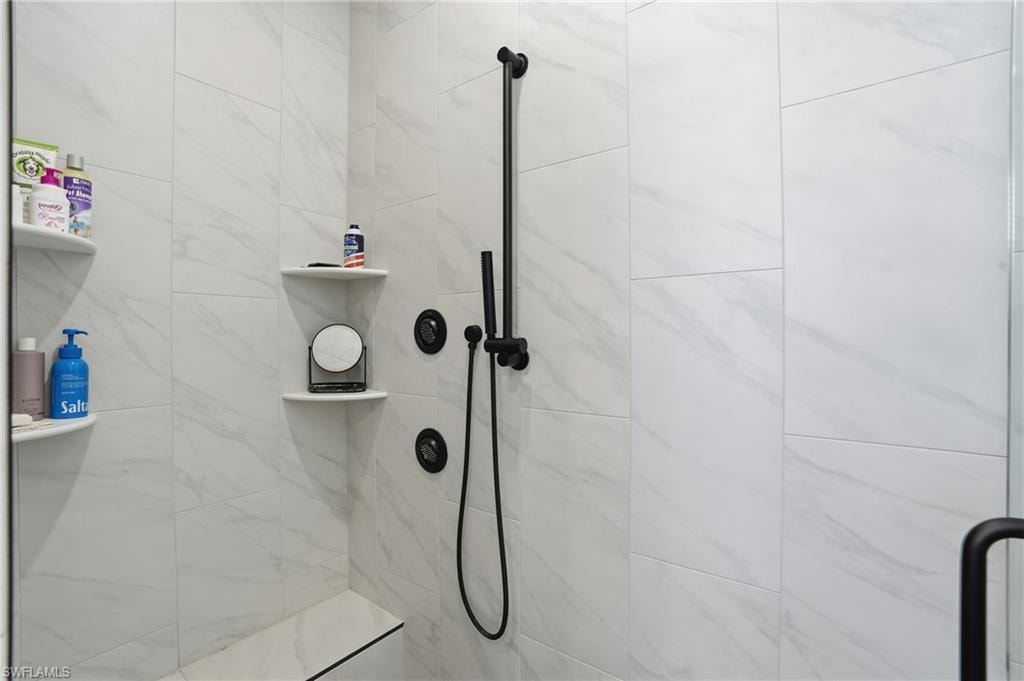 Bathroom featuring a tile shower