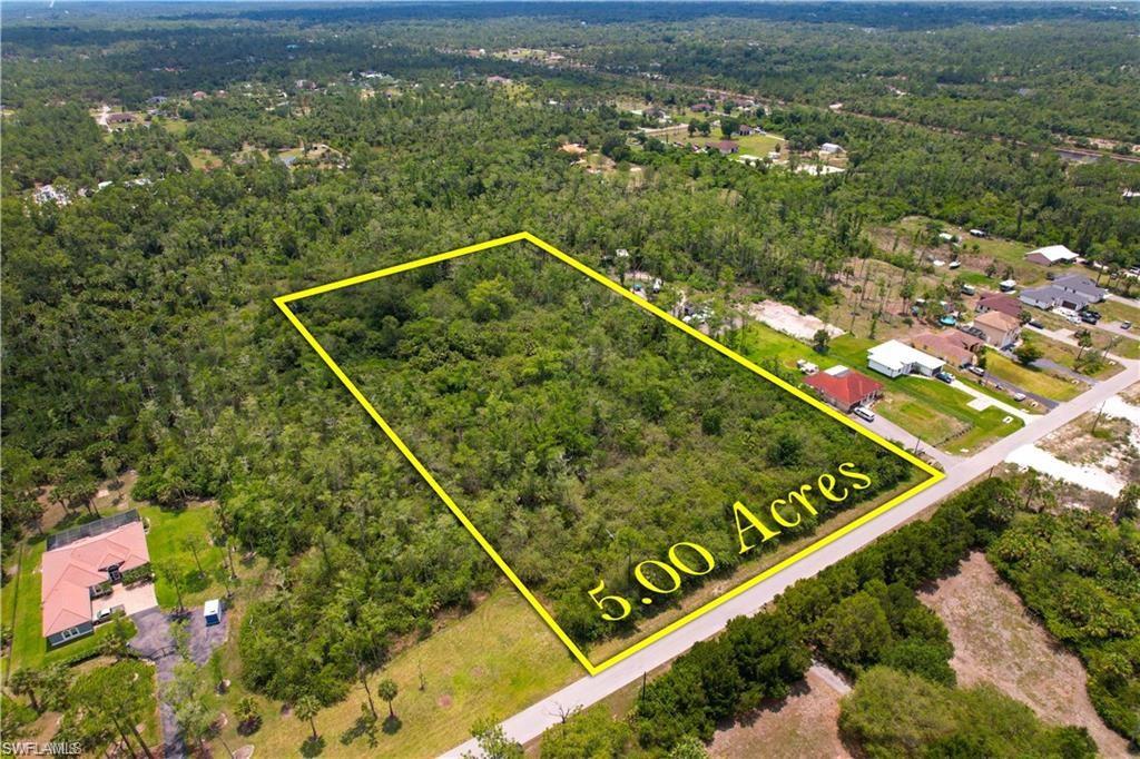 Aerial overview of property's location with a forest and property parcel outlined