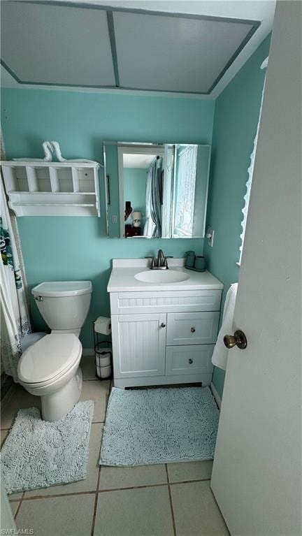 Full bath featuring vanity, light tile patterned flooring, and curtained shower