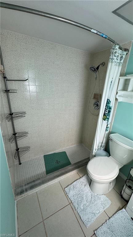 Full bathroom with a shower stall and tile patterned floors