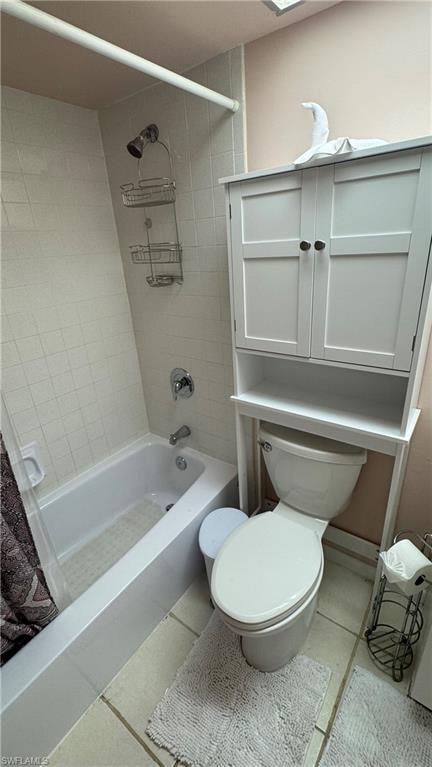 Bathroom featuring tile patterned flooring and shower / tub combo