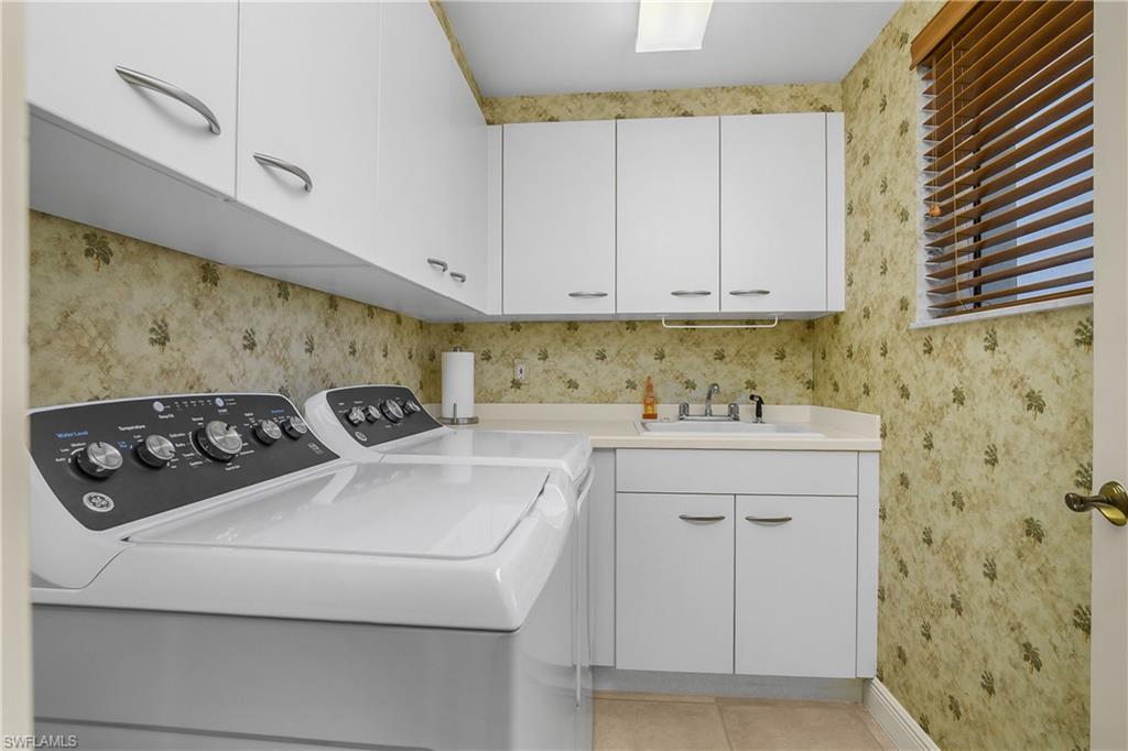 Laundry located off of den.