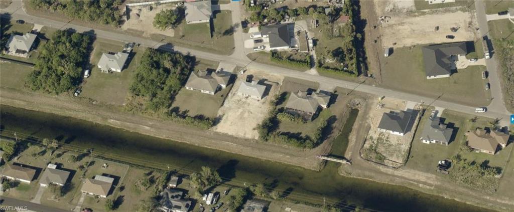Aerial view of property's location featuring property parcel outlined