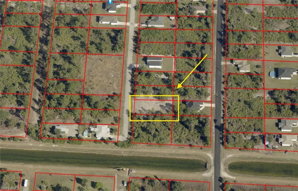 Aerial map of property and surrounding area featuring property parcel outlined