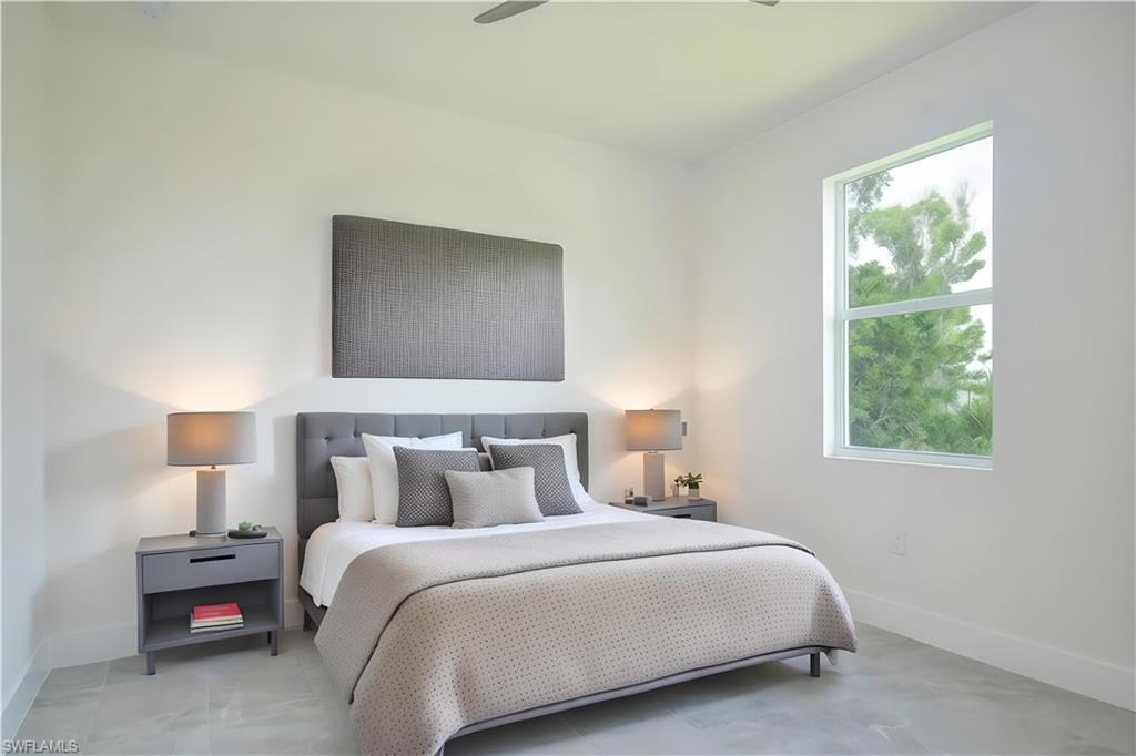 Bedroom featuring baseboards and ceiling fan