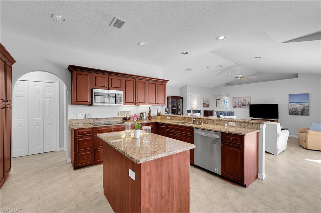 2nd refrigerator in laundry room, double ovens,high speed kettle, pantry and volume ceiling