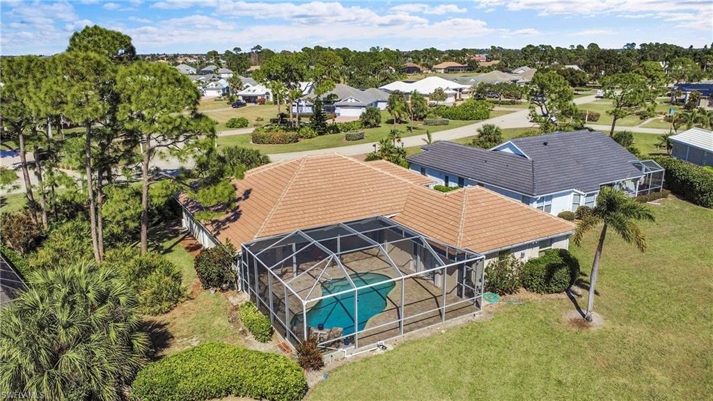 Aerial perspective looking northwest.  The tropical landscaping provides lots of privacy for pool area.