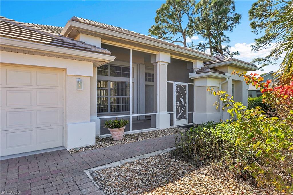 Property entrance featuring a screened front porch, gutters, new carriage lighting and destinctive architectural details