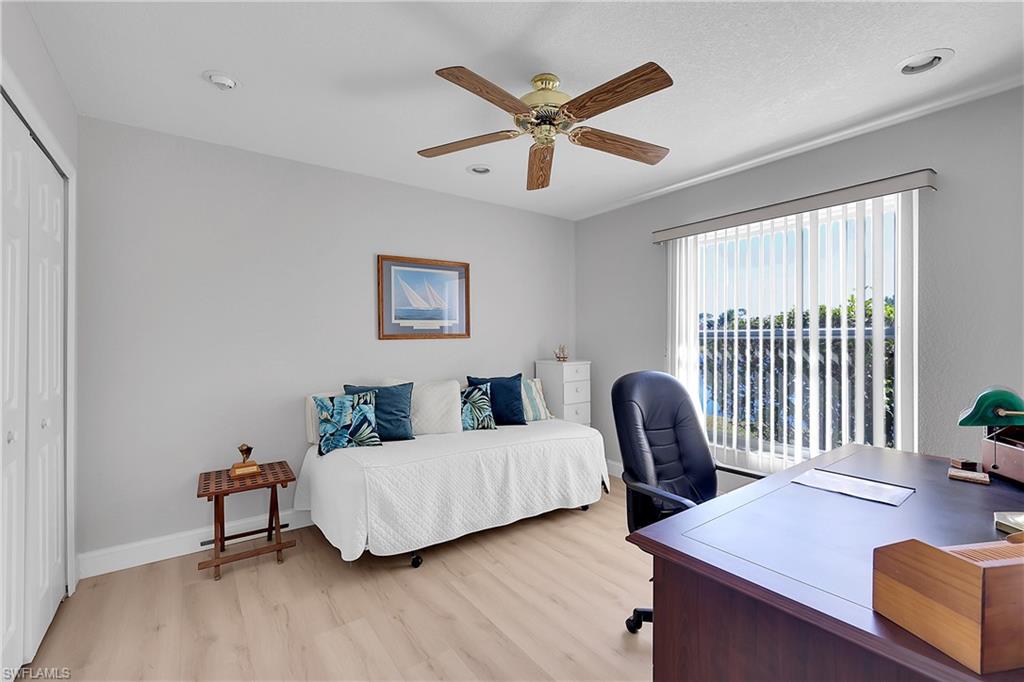 3rd Bedroom features a lake view, office area, two closets, light wood-style flooring, ceiling fan, and recessed lighting