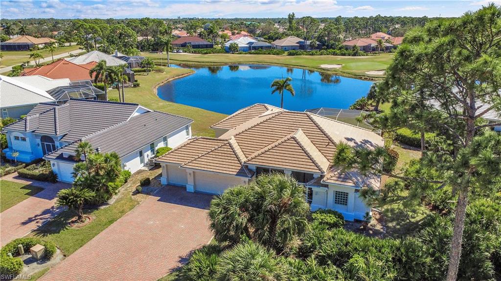 Aerial perspective shows that the driveway can easily accomodate eight cars, one of the most sought-after neighborhoods in Burnt Store Marina. It's a two minute golf cart ride to the golf club, tennis, marina, Platinum Point Yacht Club and restaurants.
