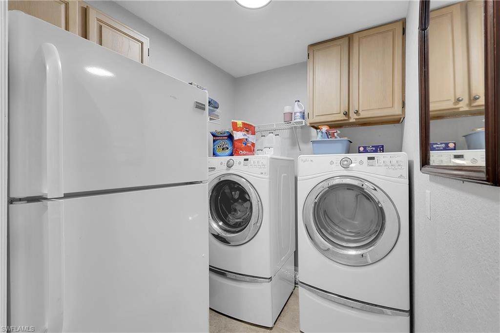 Laundry area with washing machine and dryer and cabinet space, 2nd refrigerator, easy access to garage