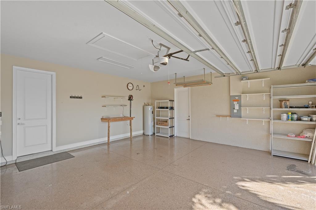 Garage with electric panel and water heater