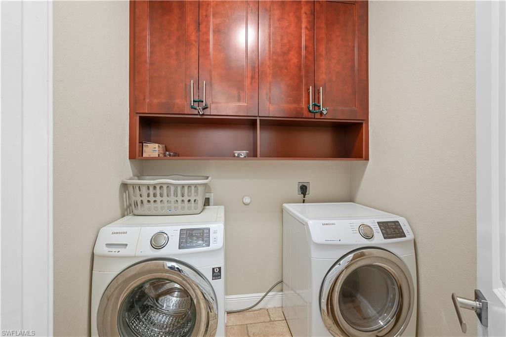 Laundry area with cabinet space and separate washer and dryer