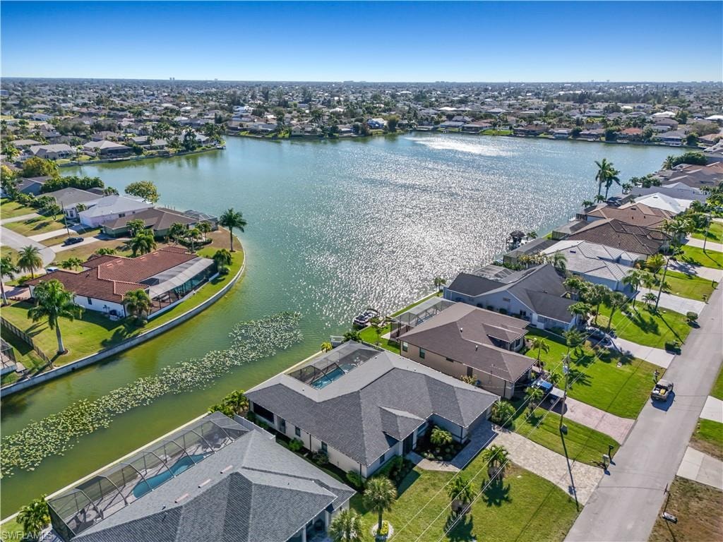 Aerial perspective of suburban area featuring a large body of water