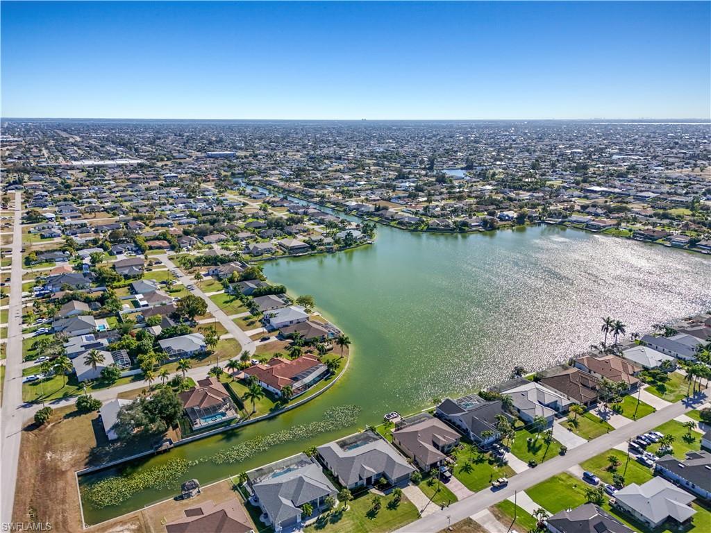 View of property location with nearby suburban area and a nearby body of water