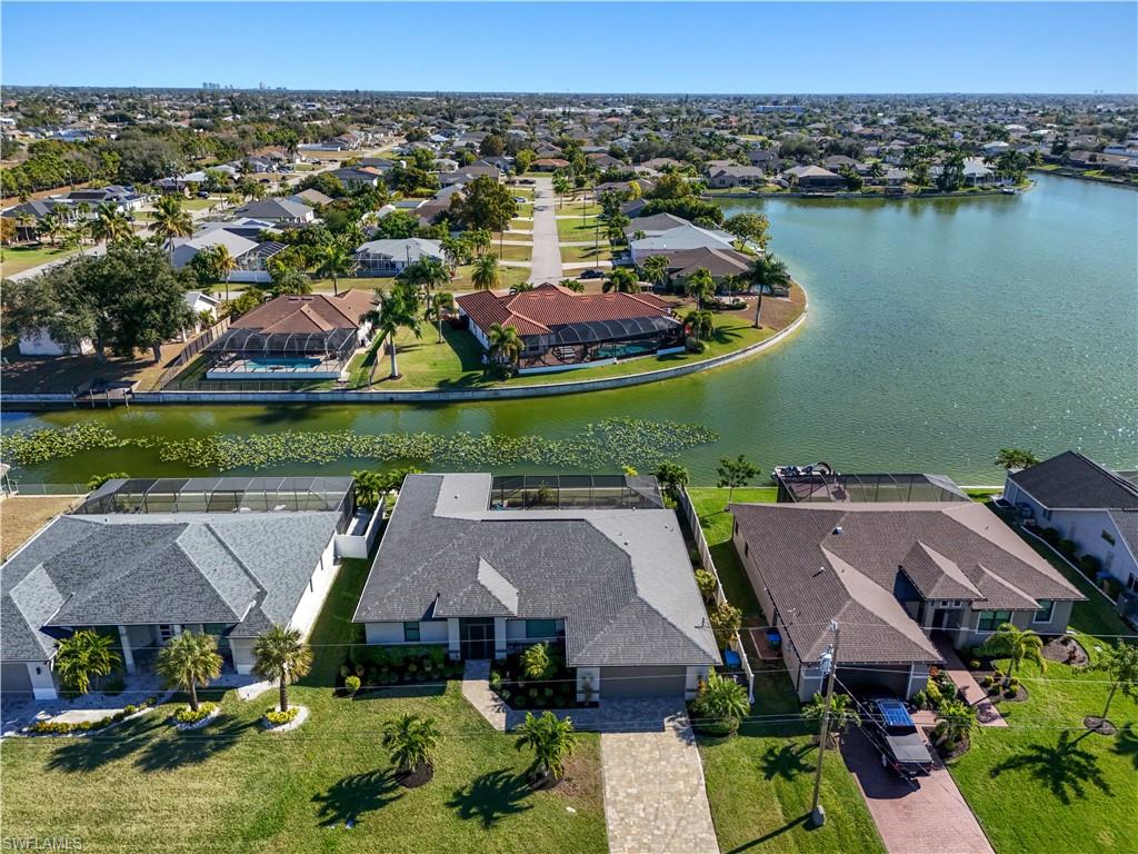 Aerial view of residential area featuring a large body of water