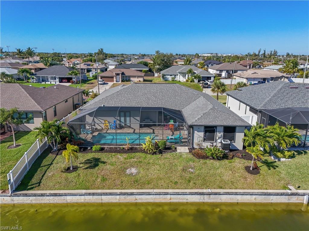Aerial view of residential area with a large body of water