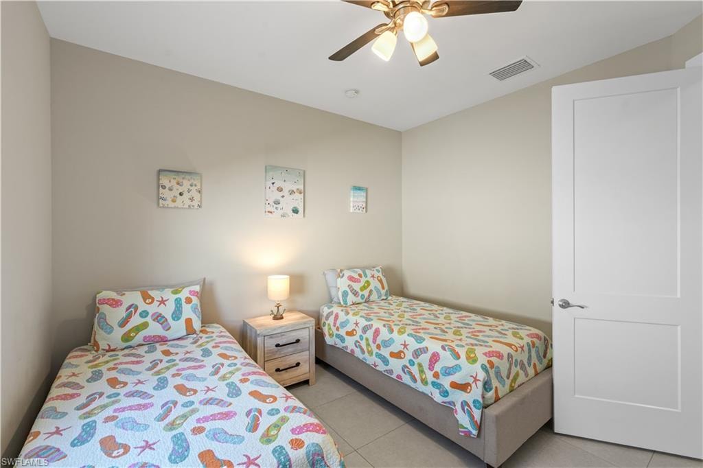 Bedroom featuring ceiling fan and light tile patterned floors