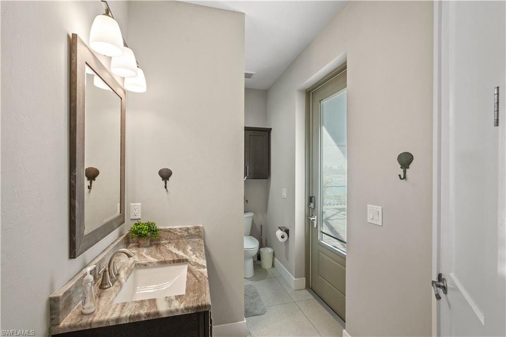 Bathroom featuring vanity and light tile patterned floors