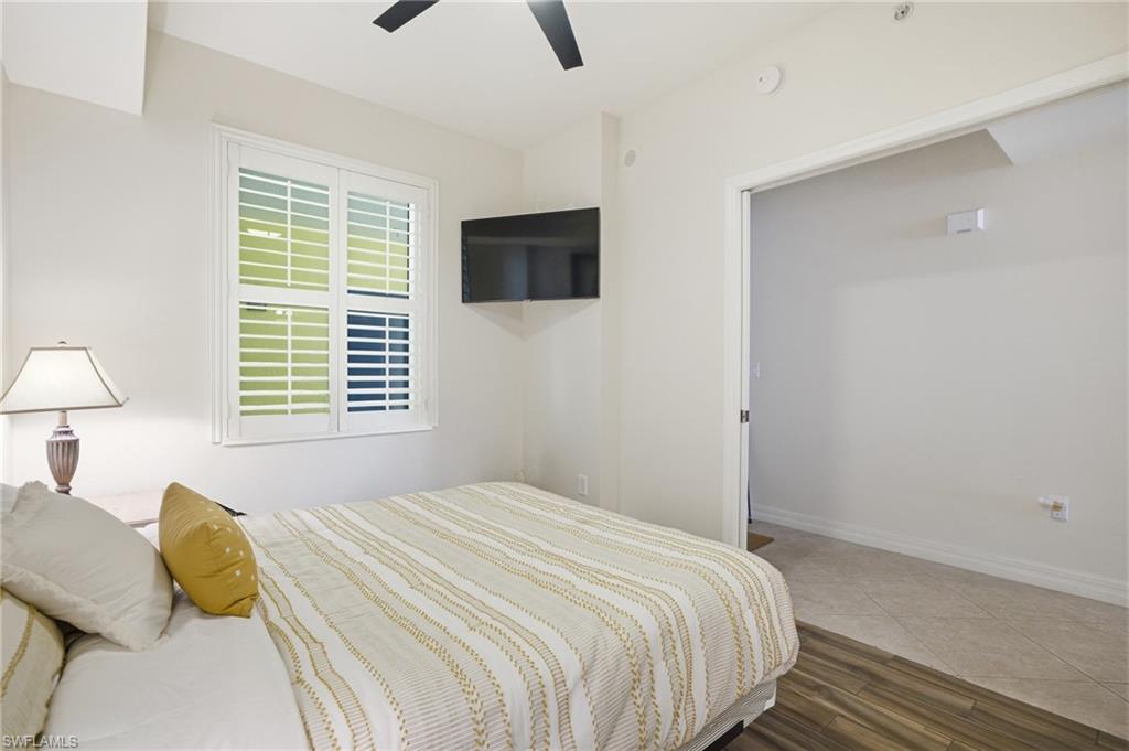 Bedroom featuring wood finished floors and a ceiling fan