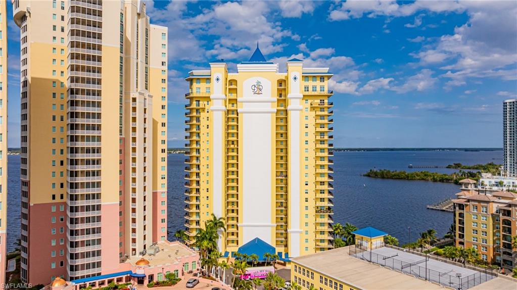 View of property with a water view