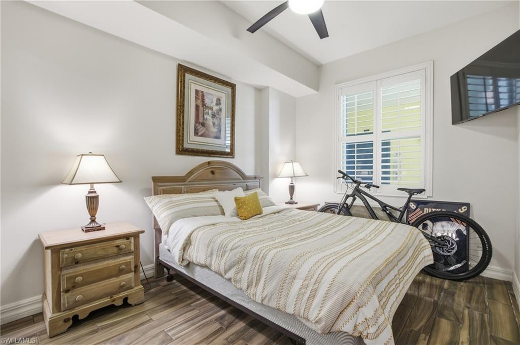 Bedroom with wood finished floors and ceiling fan