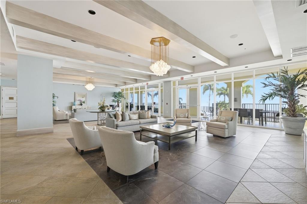 Building lobby featuring beam ceiling