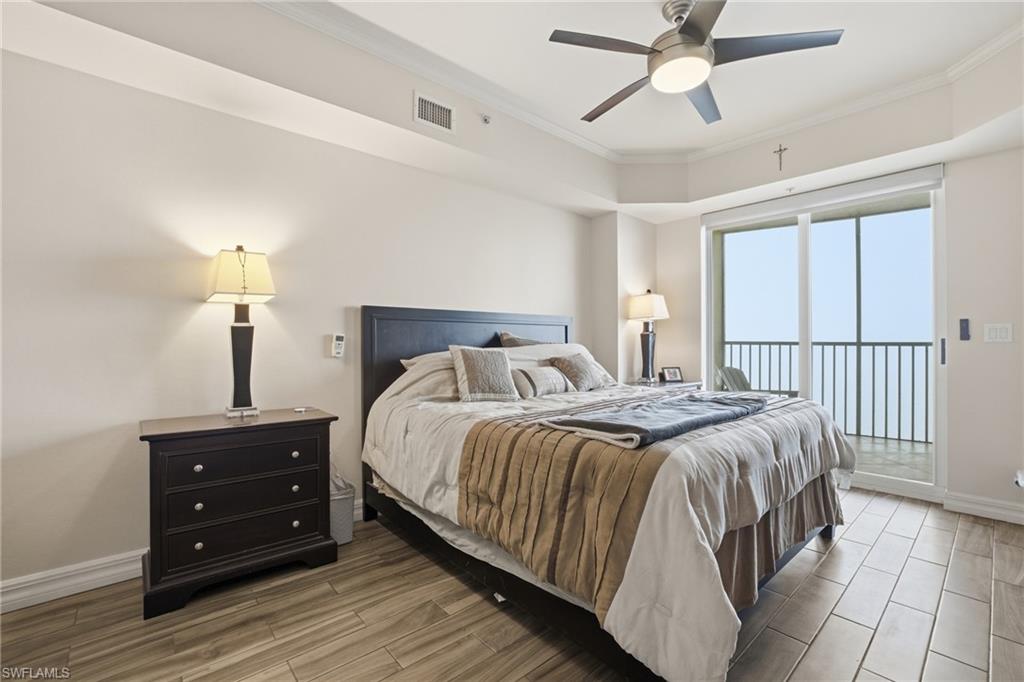 Bedroom with wood finish floors, crown molding, access to outside, and a ceiling fan