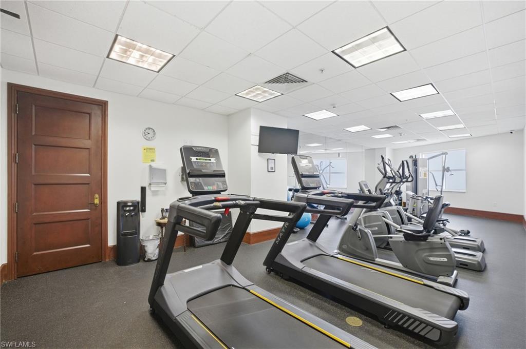 Workout area featuring a paneled ceiling