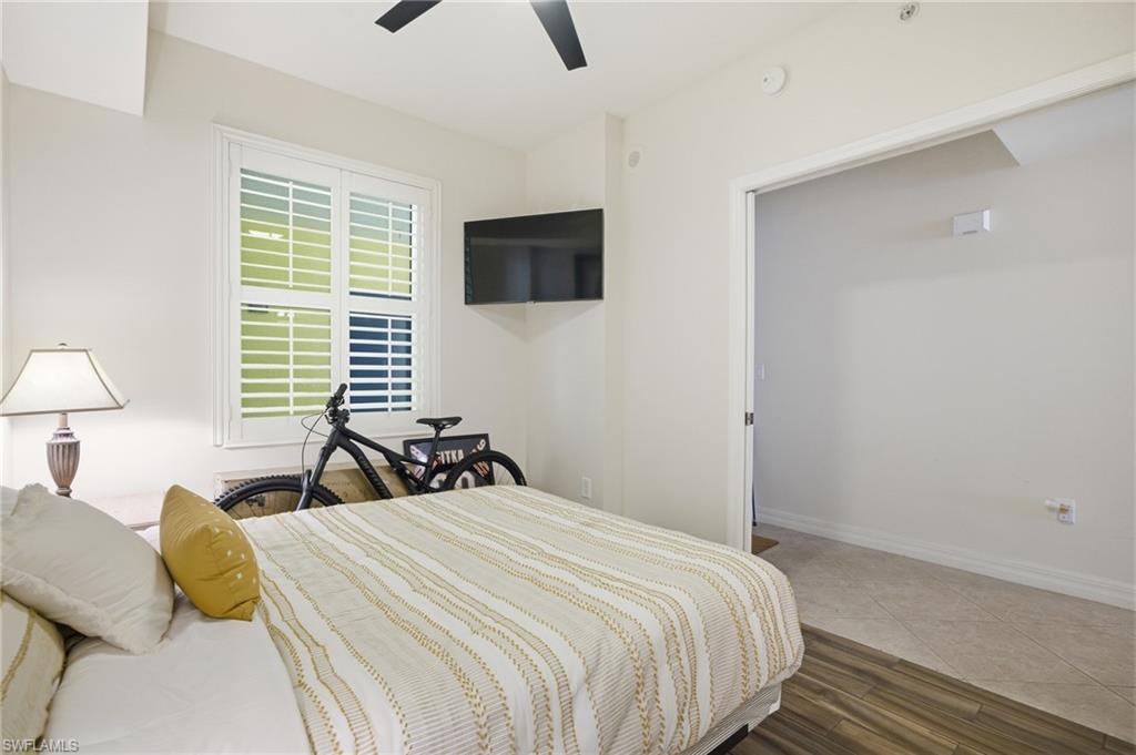 Bedroom featuring dark wood finished floors and ceiling fan