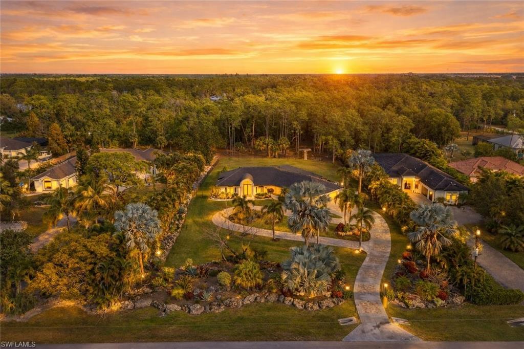 Aerial view at dusk of a residential view and a forest view
