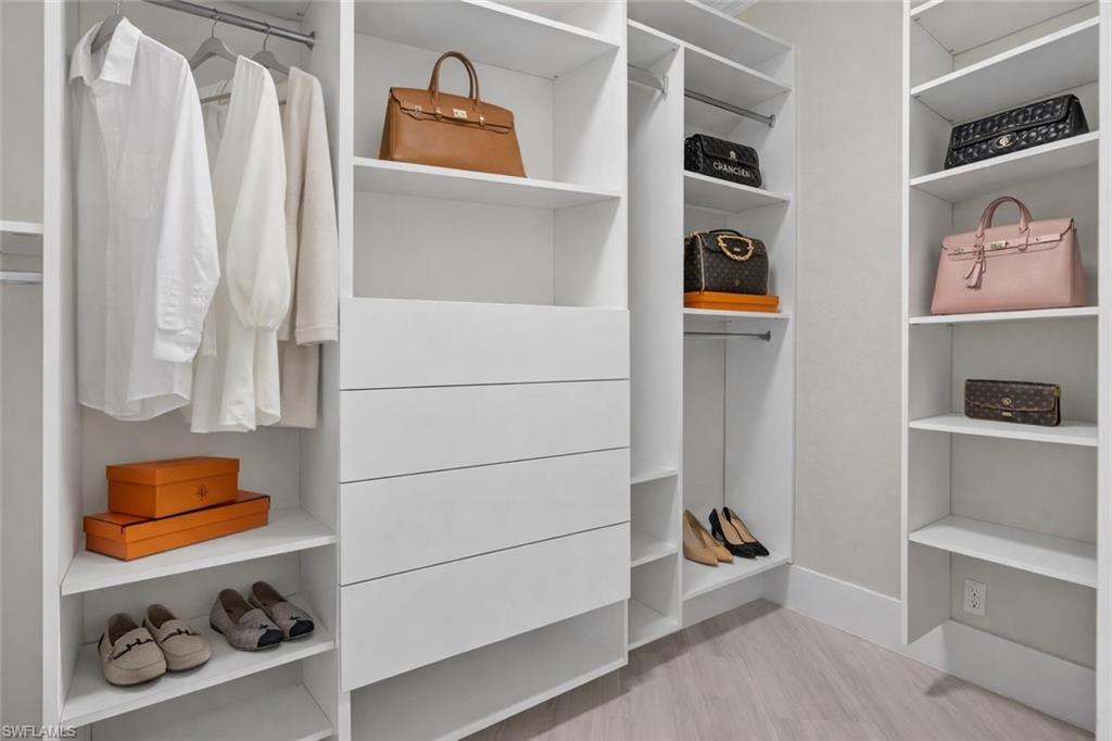 Walk in closet featuring light wood-type flooring