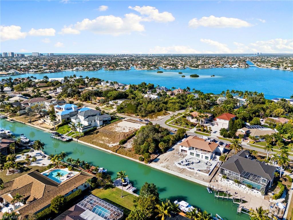 Aerial view of residential area with a large body of water