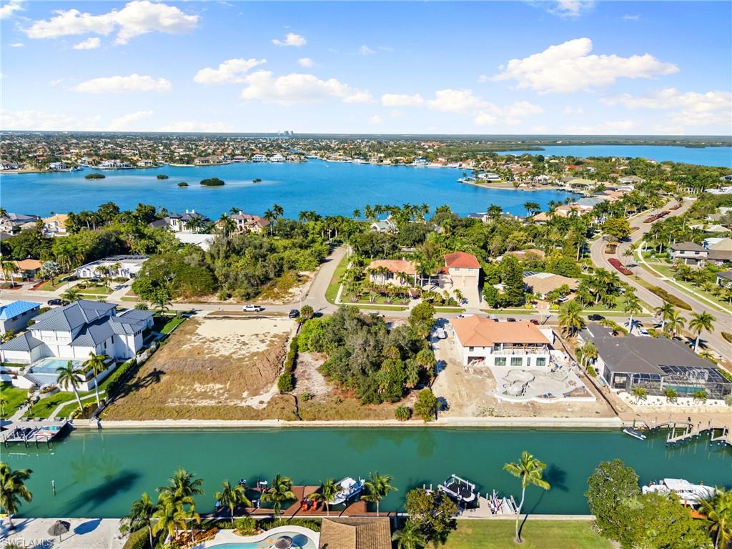Aerial view of residential area with a large body of water