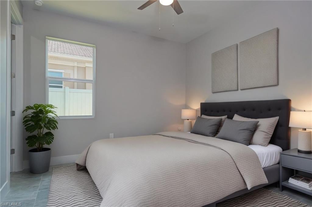 Bedroom featuring baseboards and ceiling fan