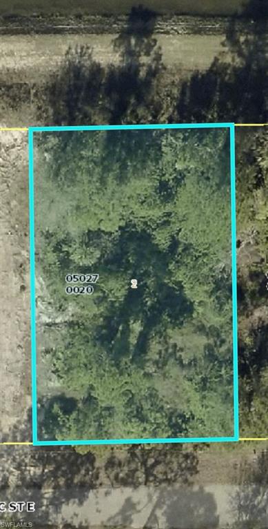 Aerial overview of property's location with property parcel outlined