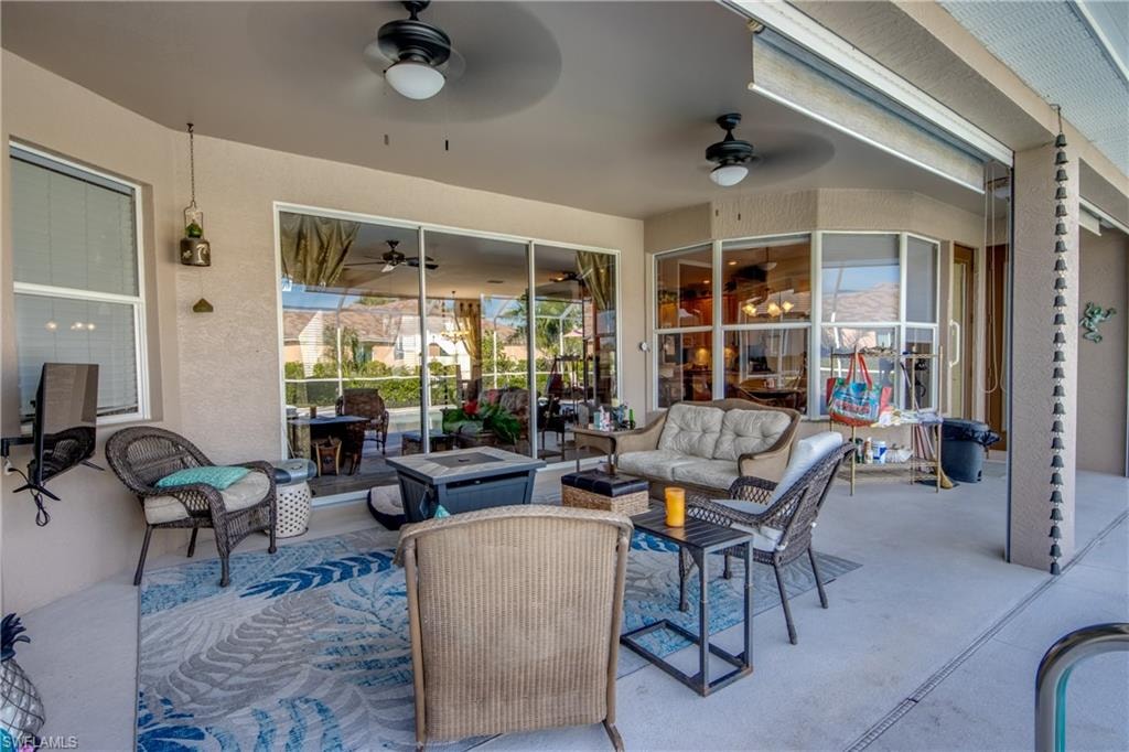 View of patio / terrace with ceiling fan and an outdoor living space