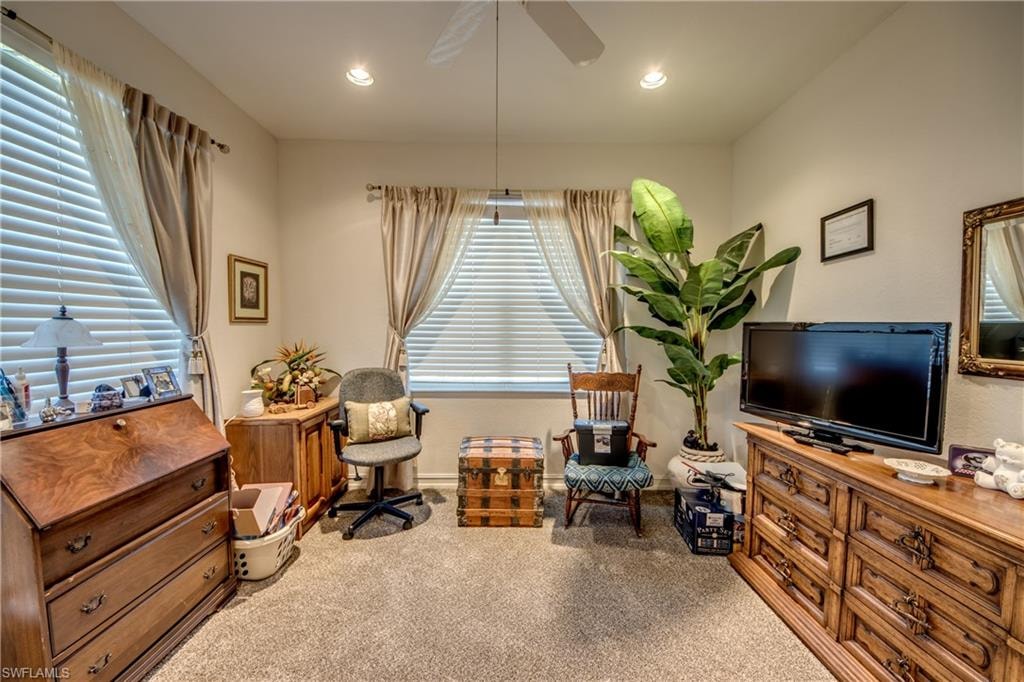 Living area with ceiling fan, carpet, and recessed lighting