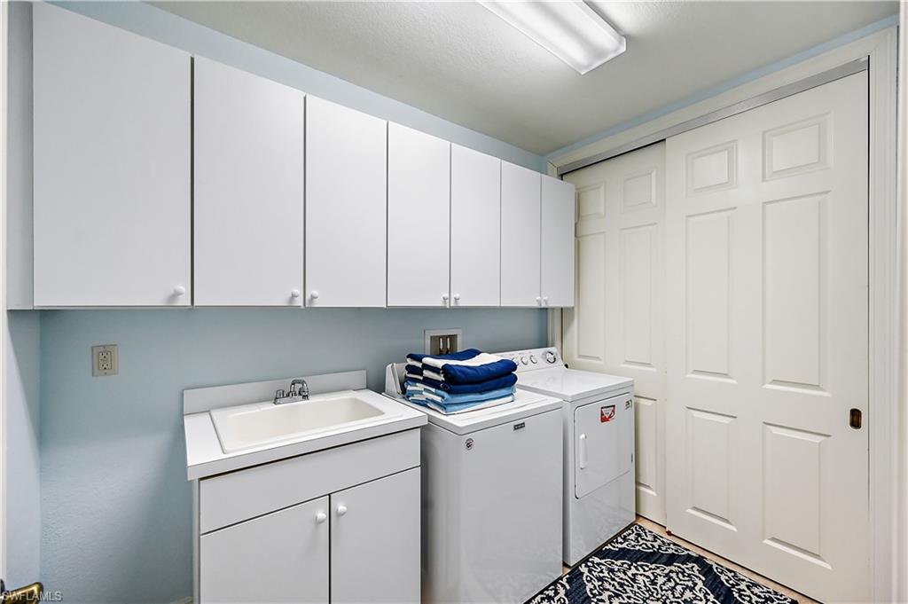 Laundry area with cabinet space and washer and dryer