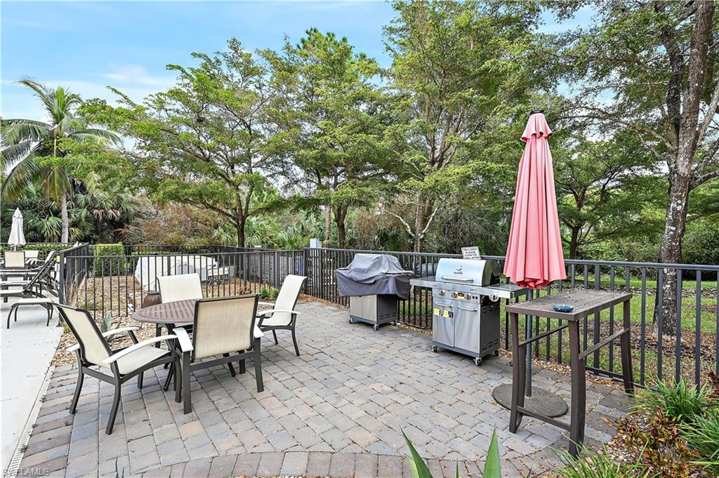 View of patio featuring outdoor dining area and area for grilling