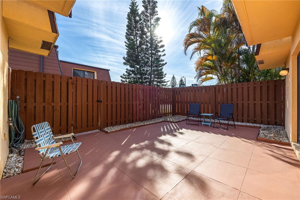 Fenced backyard with a patio area