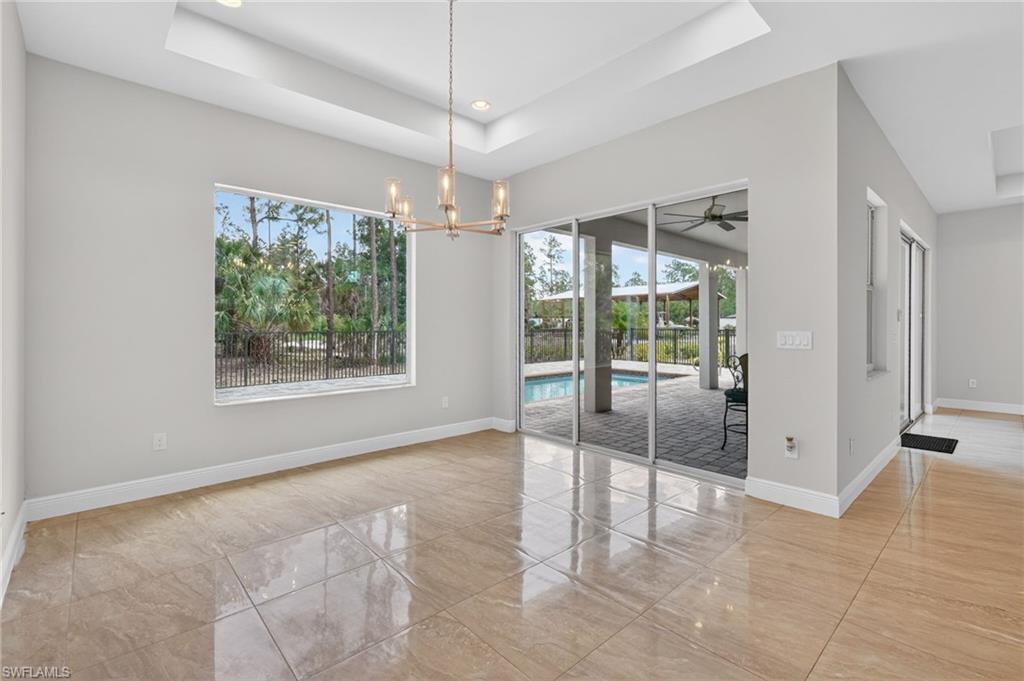 Dining room overlooking back yard and pool