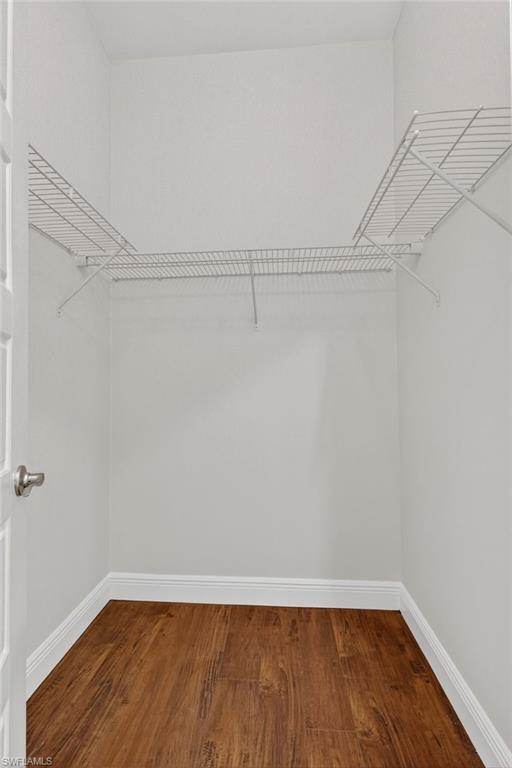 Primary bedroom 1 of 2 walk in closets